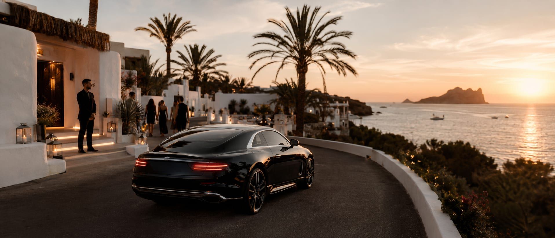 An evening transfer along an Ibiza coast road during the summer season, timed for a marina dinner and the club nights after.