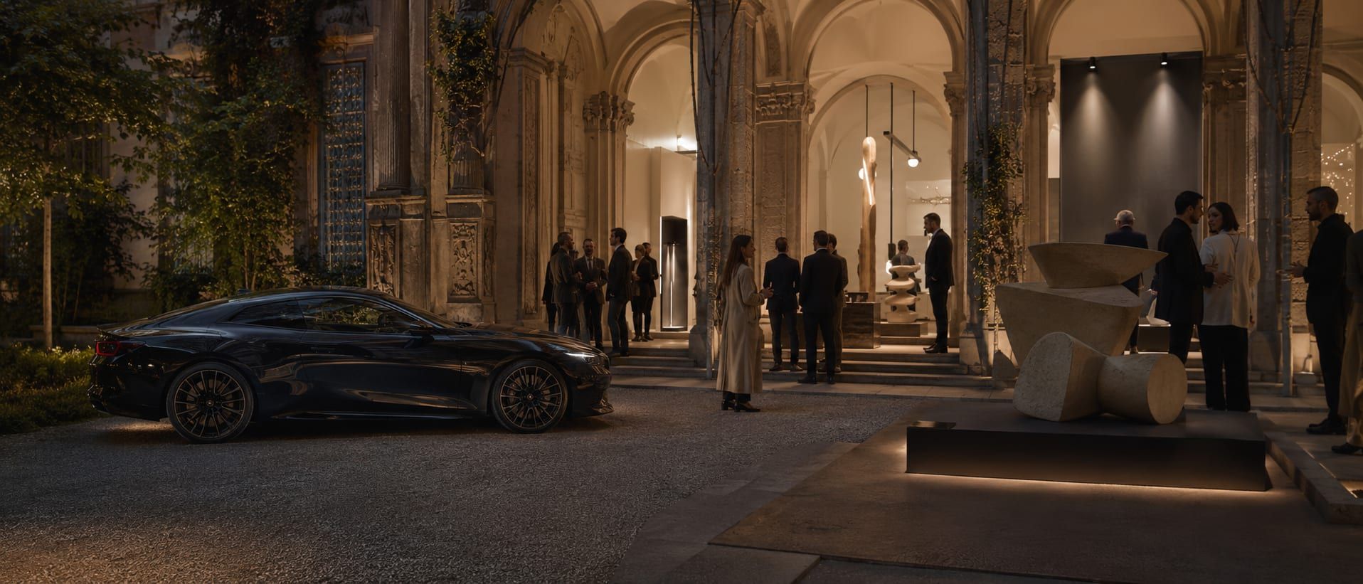 A prepared car waiting outside a Milan design hotel at golden hour during Design Week, ready for the drive out to Lake Como.